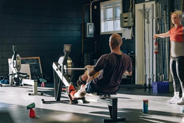 Man exercising on a rowing machine at CrossFit 801