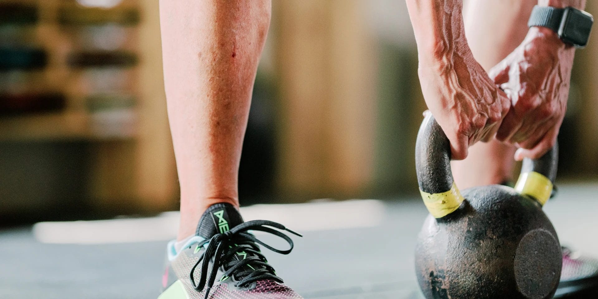 Man lifting kettlebell at CrossFit 801