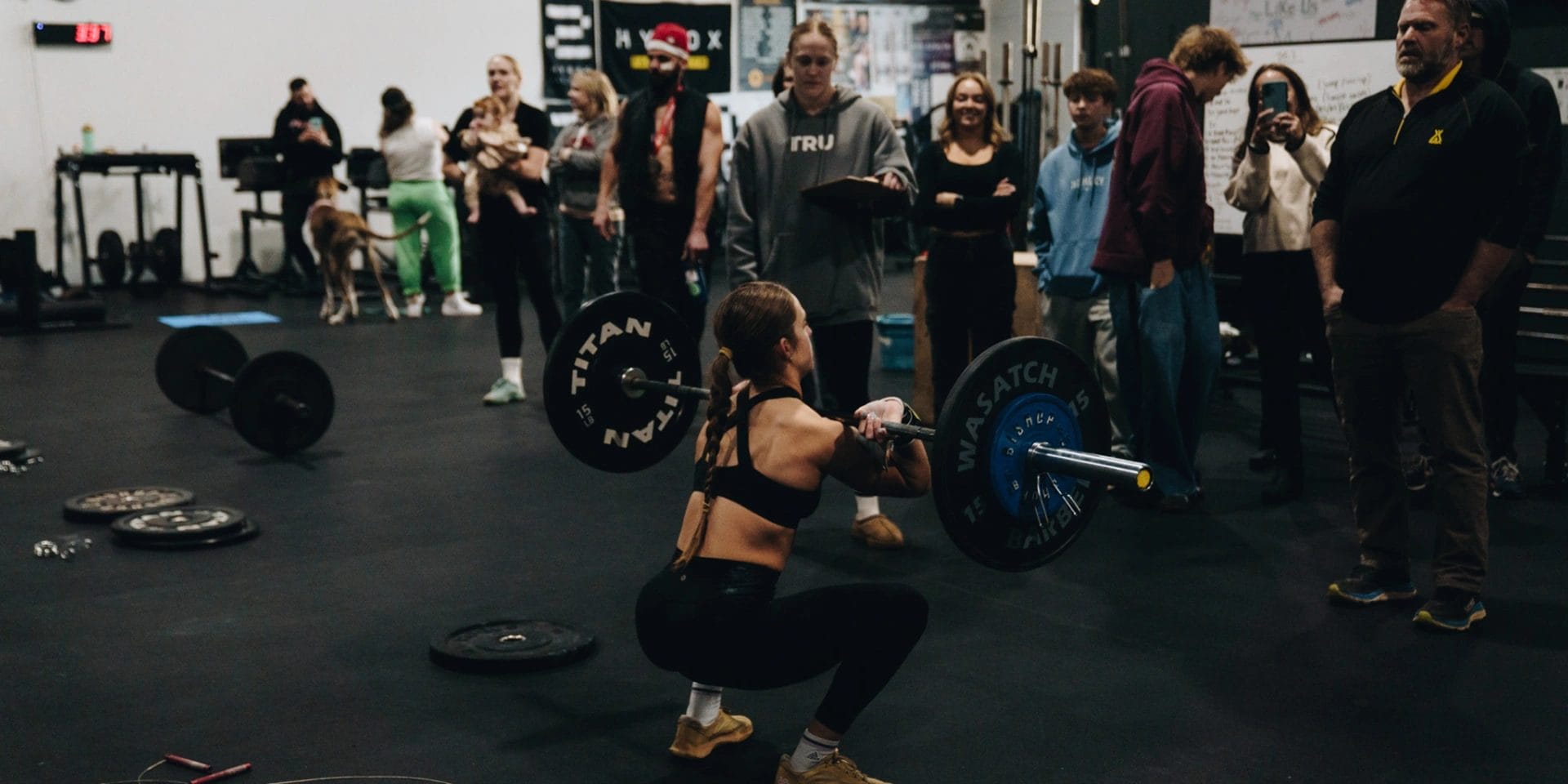 woman squatting at CrossFit 801